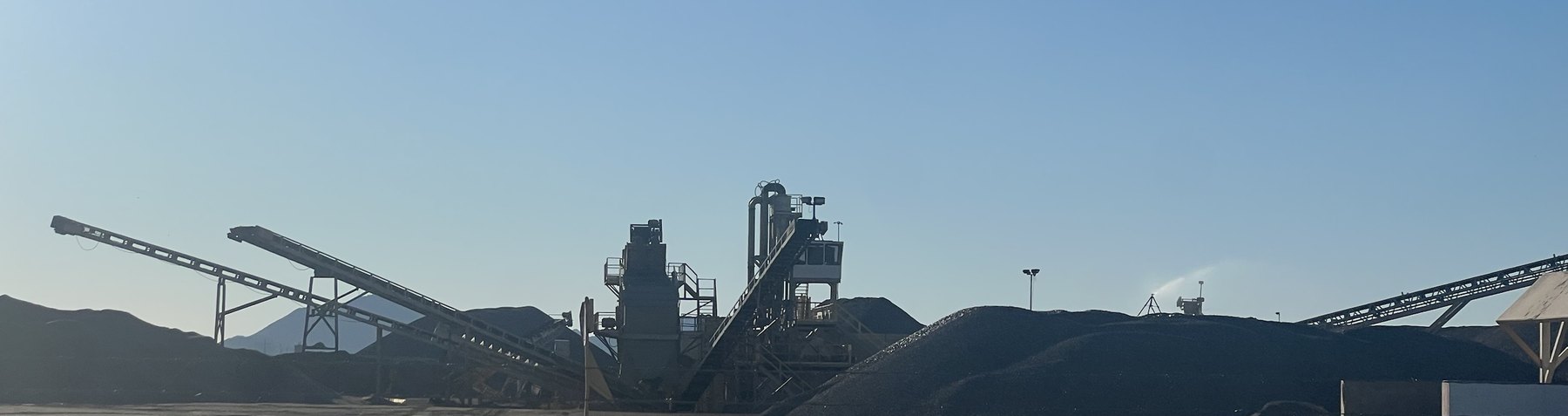 Sand and gravel plant with conveyors and aggregate stockpiles in Arizona