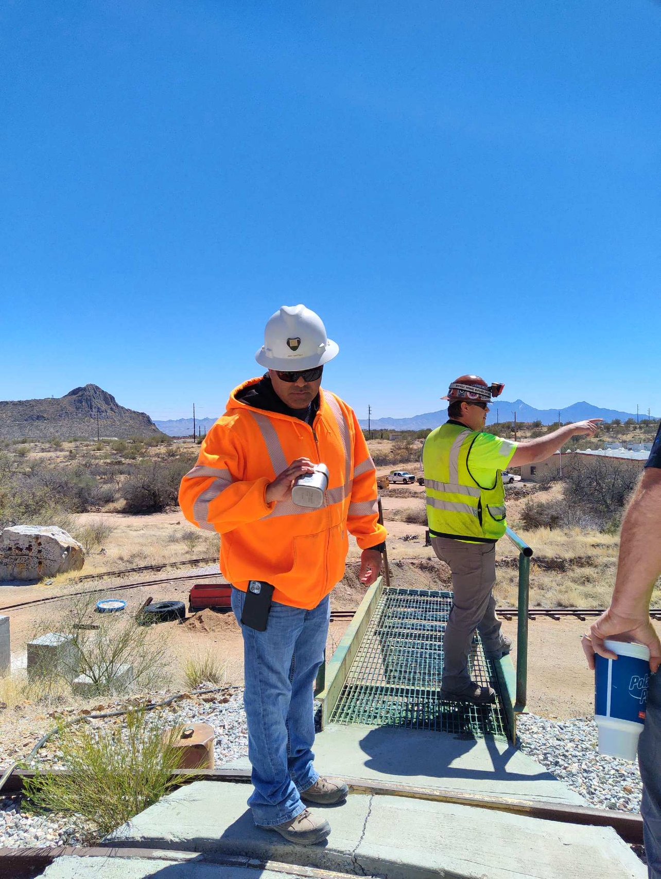 Jody Martinez in a white hard hat and orange high-visibility jacket at a Freeport-McMoRan site