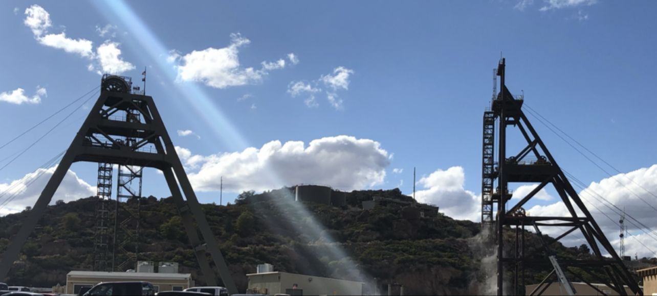 Two mine headframes against the Arizona sky